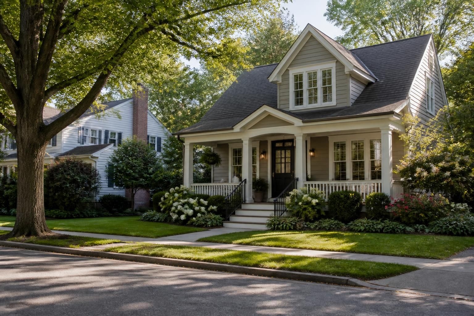 Quiet tree-lined street with mature trees and manicured lawns.